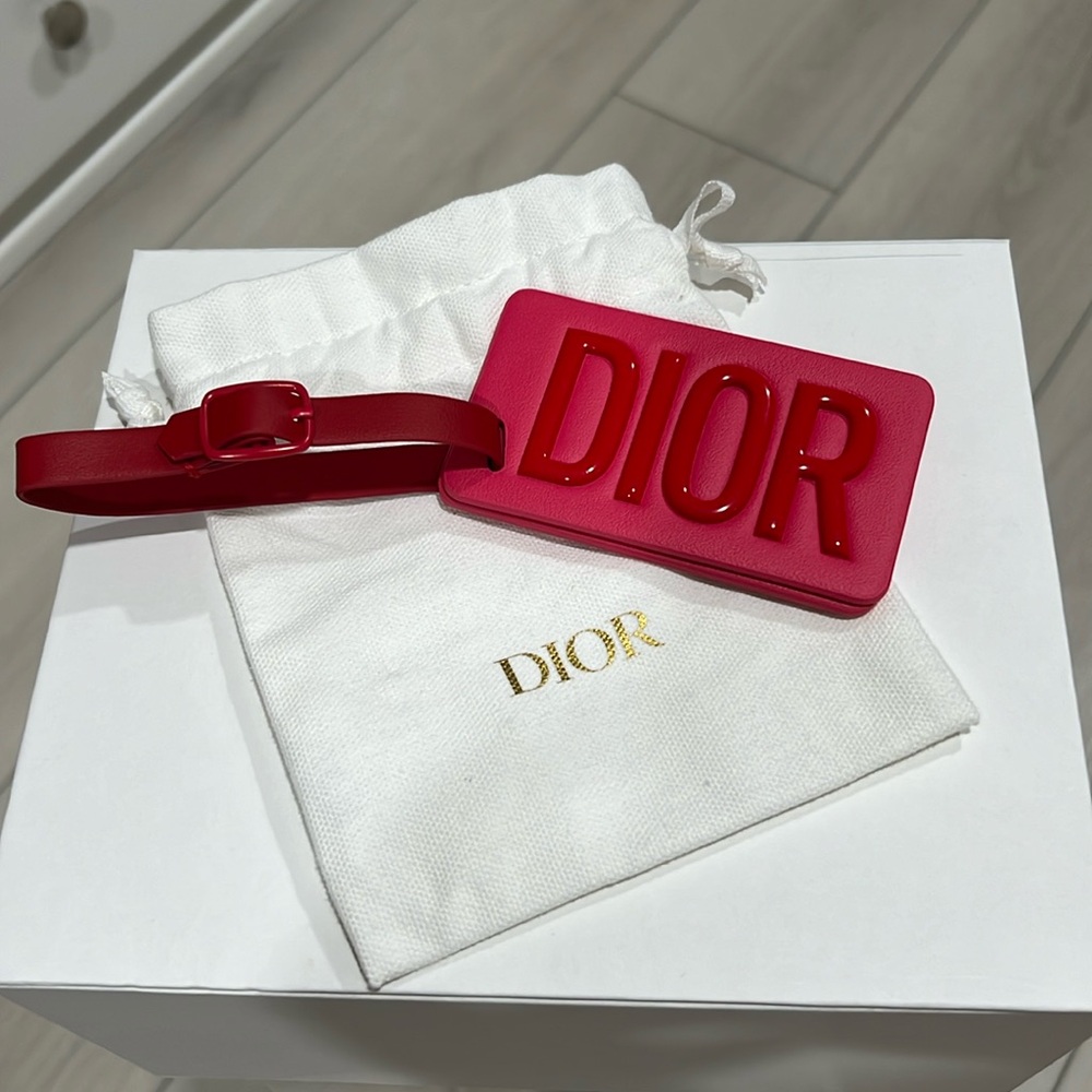 Pink Dior luggage tag.